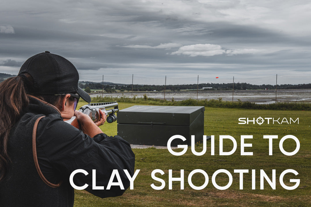 Woman practicing clay target shooting with a camera mounted on her shotgun