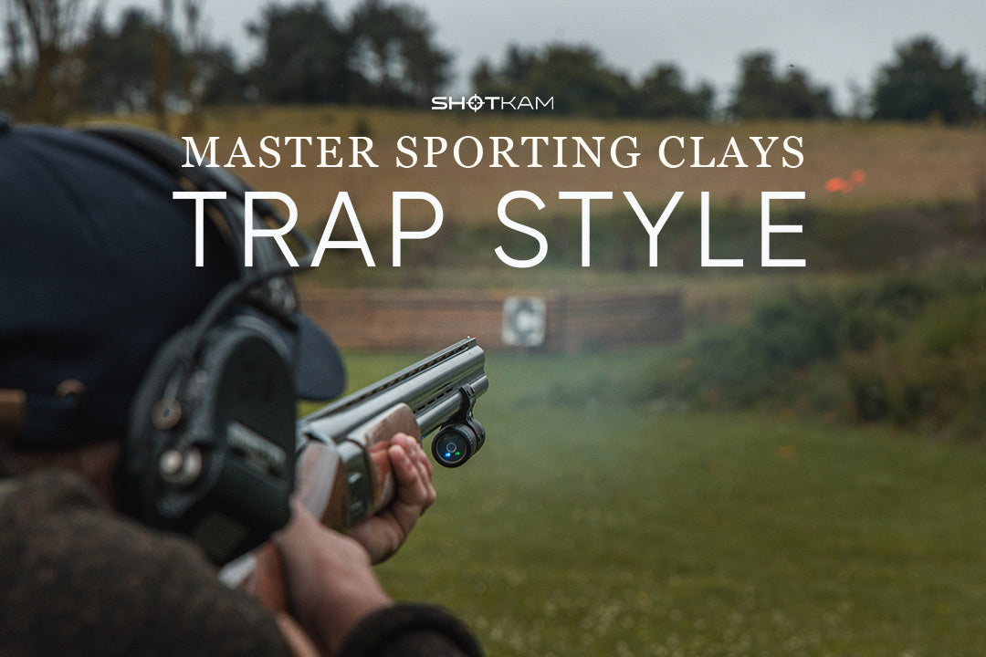 British shooter with over-under shotgun and ShotKam aiming at outgoing trap target during a UK clayshooting event.
