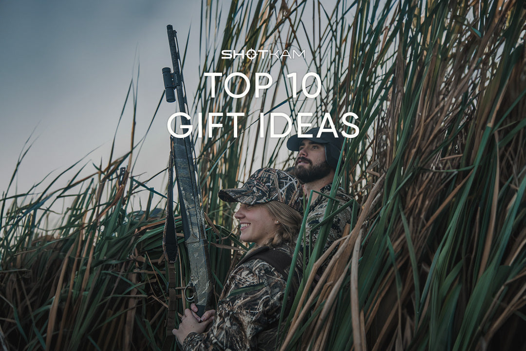 Couple dressed in camouflage gear enjoying a day of shooting in the UK, featured in ShotKam’s top 10 Valentine's gifts for outdoor enthusiasts.