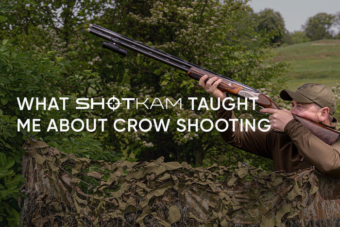 Fieldsports with Speed crow hunting scene with a shooter aiming from behind camouflage netting using ShotKam