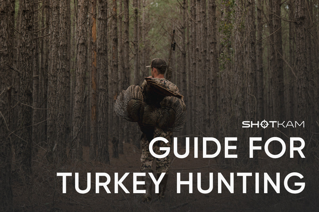 ShotKam camera on shotgun during turkey hunt as shooter walks through dense forest with harvested bird