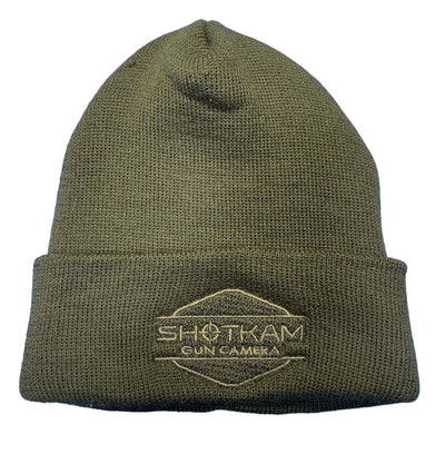 Olive green ShotKam beanie hat with embroidered ShotKam Gun Camera logo. This high-quality, warm beanie is perfect for hunters and shooting enthusiasts, providing comfort and style during outdoor adventures. Ideal for cold weather, this head covering offers reliable protection and showcases your ShotKam pride.