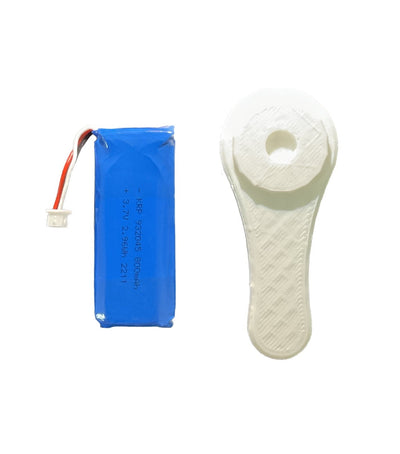 ShotKam battery replacement kit including internal battery and a white adjustment tool. This high-quality kit ensures your ShotKam camera remains powered and operational during hunting and shooting activities. Ideal for hunters and shooting enthusiasts, the battery replacement kit offers convenience and reliability, making it an essential accessory for maintaining your ShotKam camera's performance.